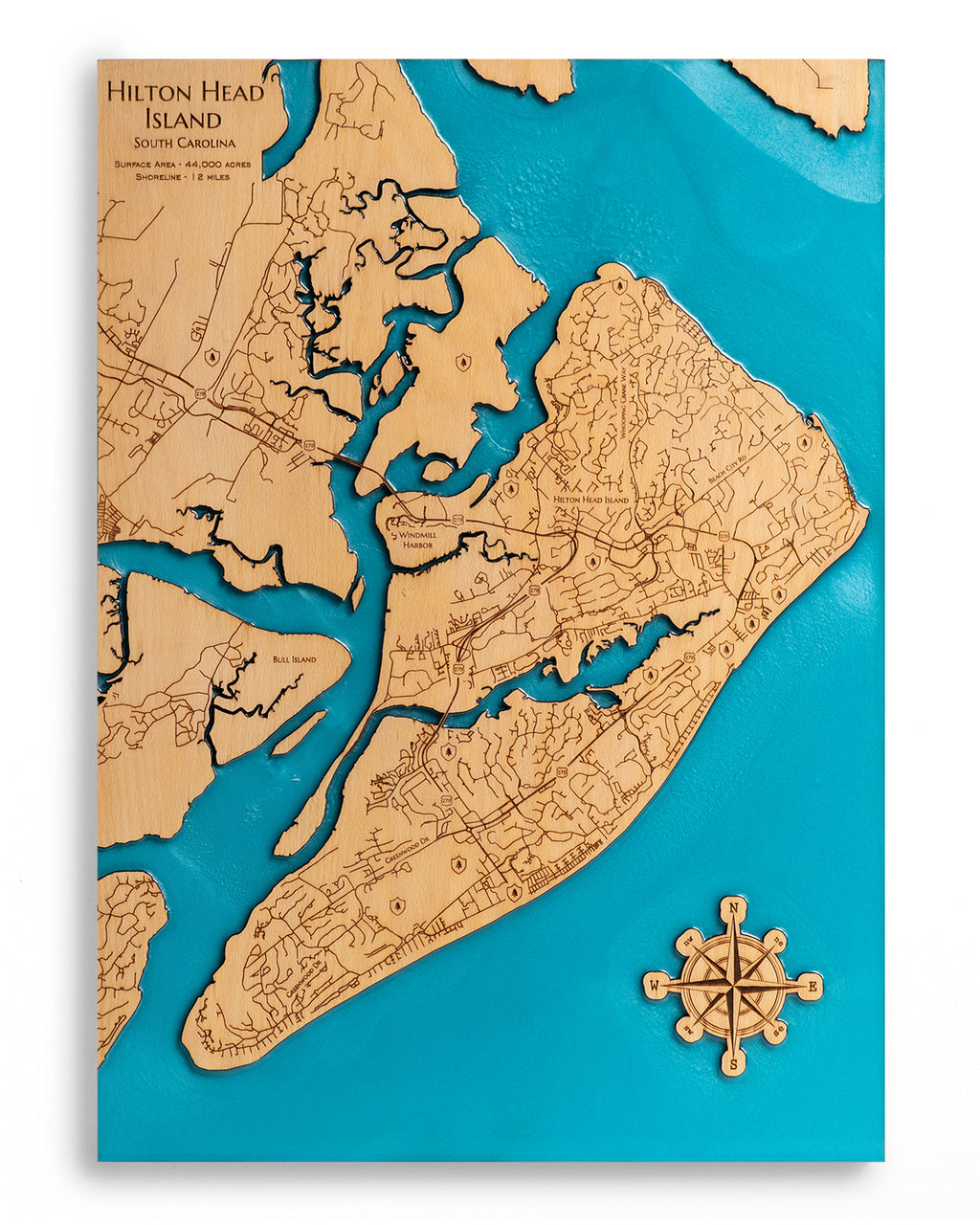 Wooden map of Hilton Head Island with a compass rose on a blue background