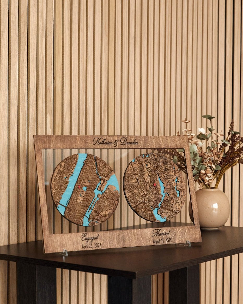 Wooden map display with engraved names and dates on a wooden surface.