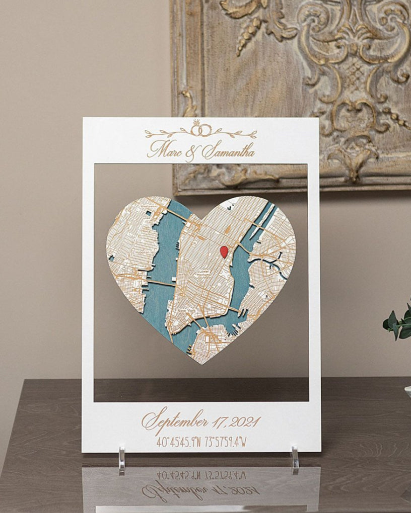 Heart-shaped map artwork on a stand with decorative background
