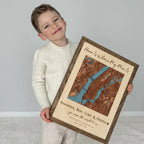 Child holding personalized custom location wood map frame gift for mom with engraved names and map  