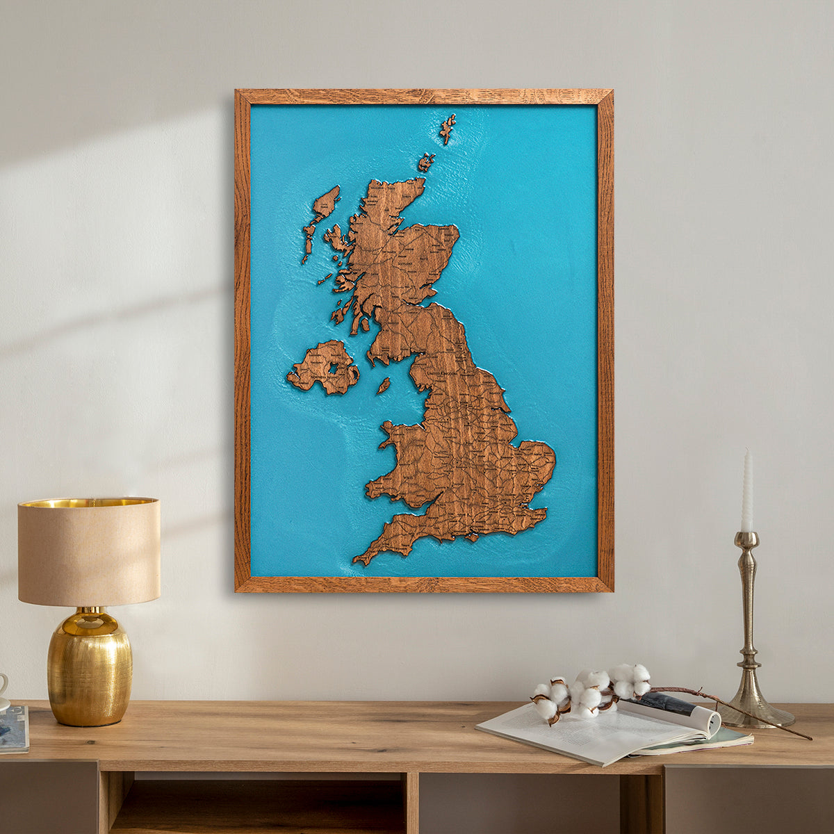 Large wooden UK map with resin hanging on living room wall
