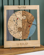 Wooden map with engraved names 'Hope & Ruth' and date 'Est. 05.05.2021' on a wooden stand.