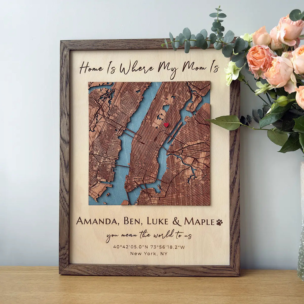 Oak-framed personalized layered wood map artwork on table with flowers, Mother’s Day gift for mom 
