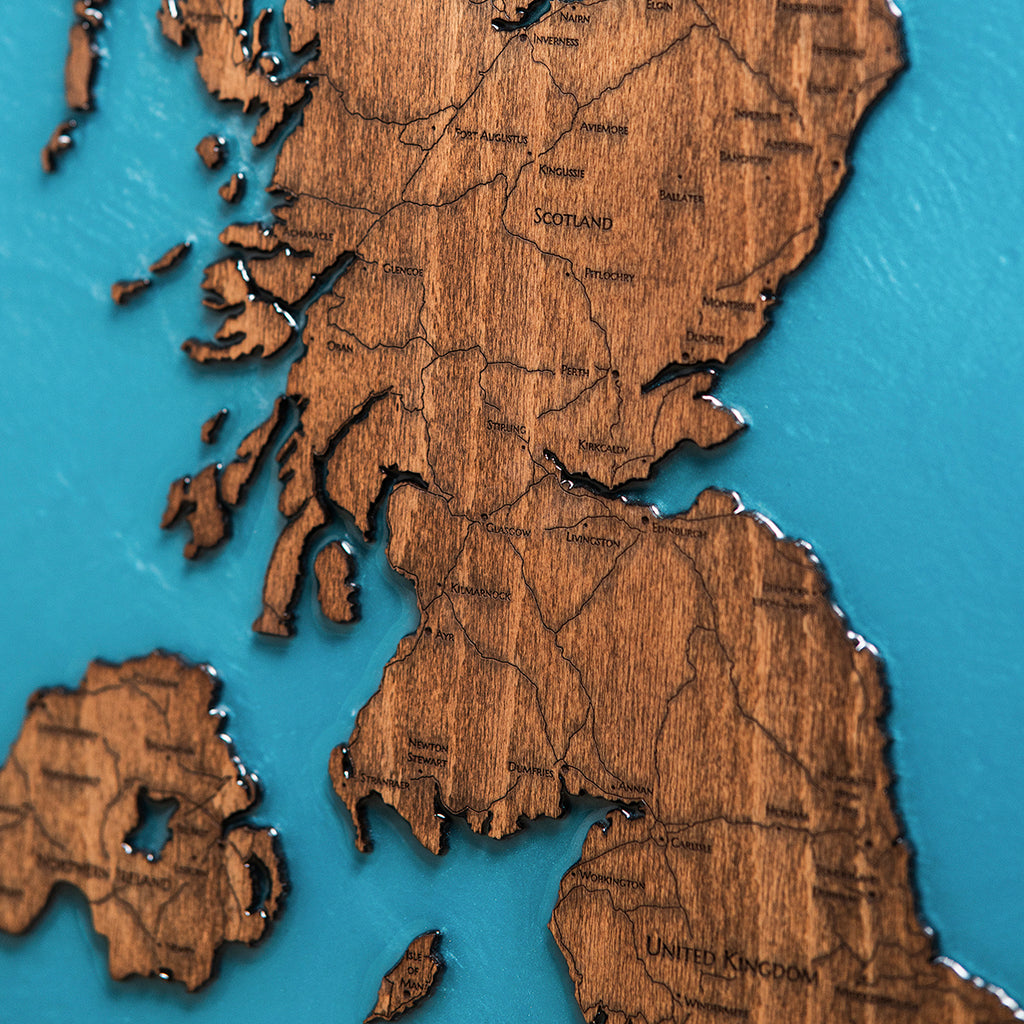Close up detail of epoxy resin ocean and wood grain on UK map
