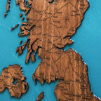 Close up detail of epoxy resin ocean and wood grain on UK map
