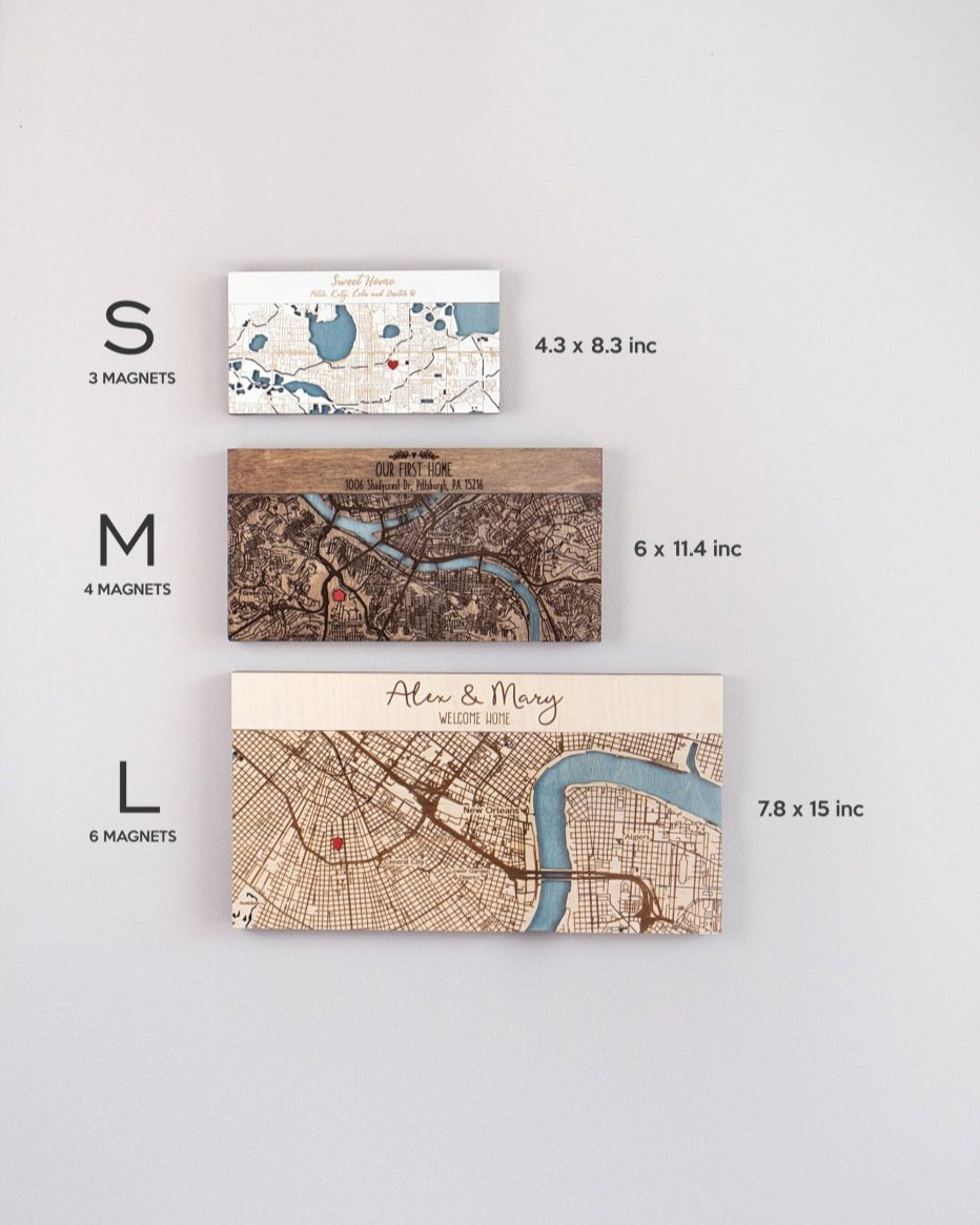 Three sizes of map magnets with dimensions and names on a light gray background