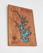 Wooden map of Lake Norman with blue water features on a white background