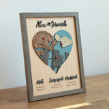 Three-location wooden heart map in a Grey oak frame with raised names and Met, Engaged, Married labels.