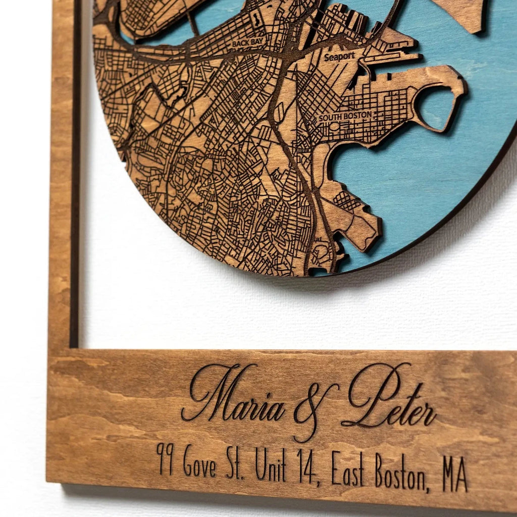 Close-up of personalized First Home map showing engraved names and address on wooden frame
