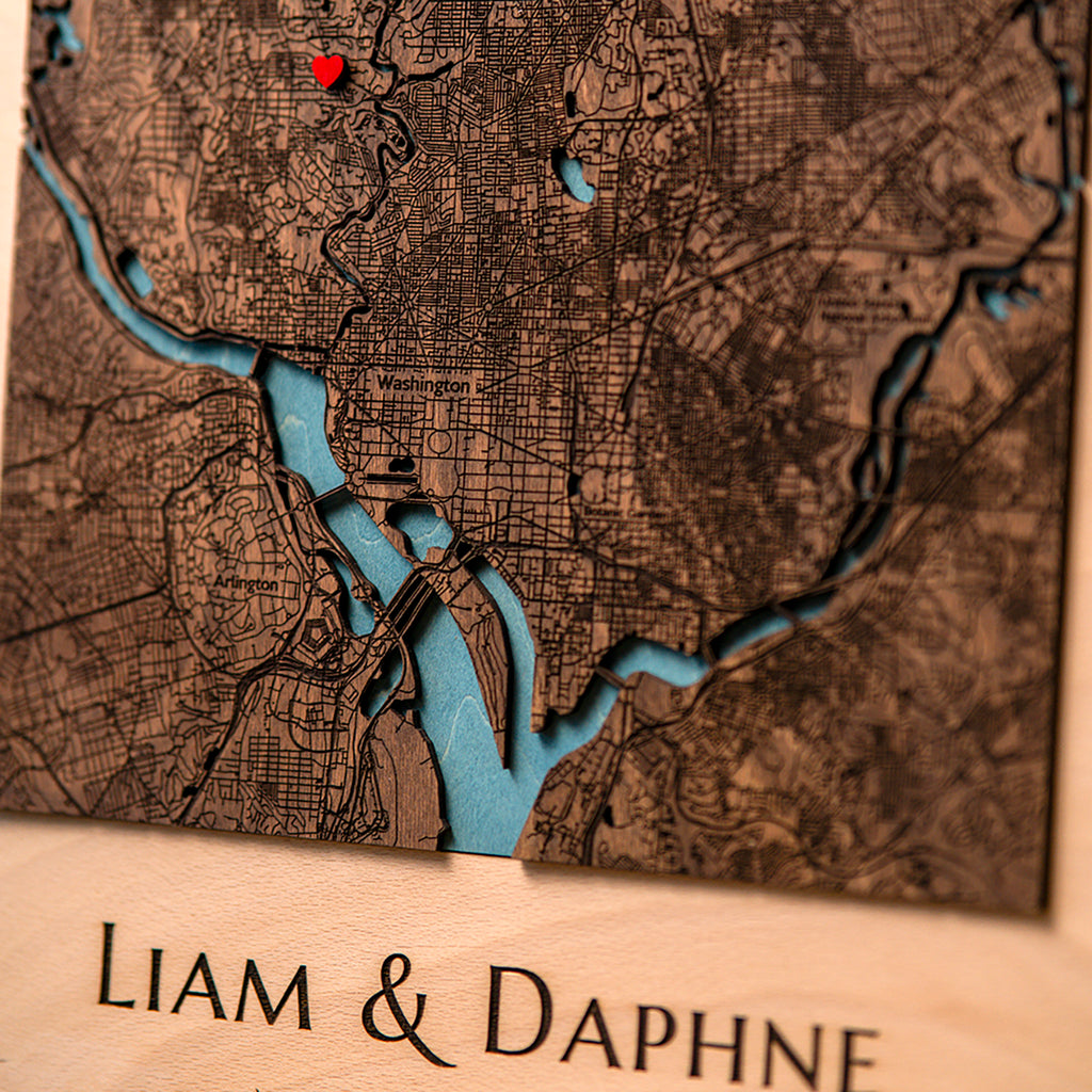 Close-up of layered 3D wooden city map with detailed streets and landmarks