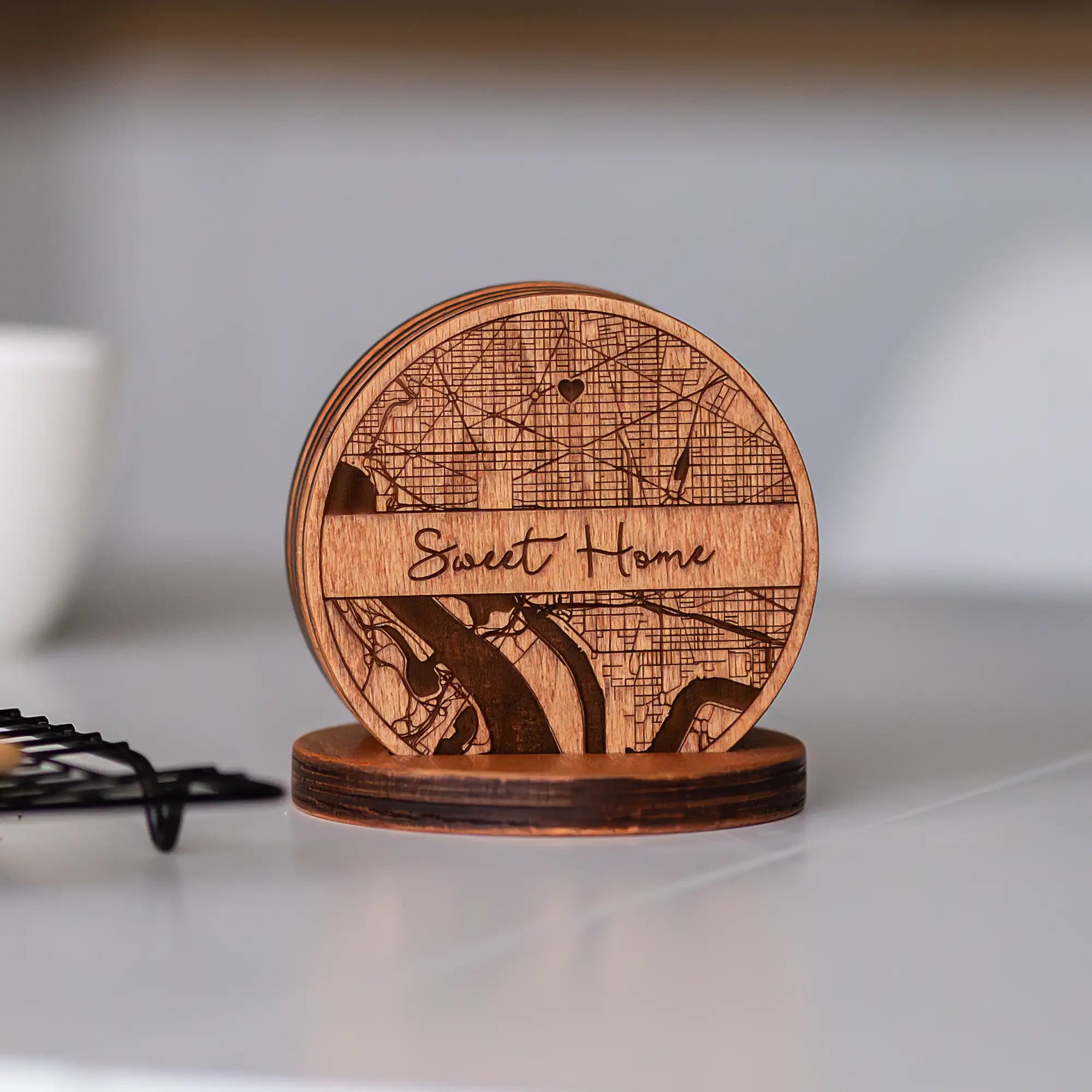 Custom engraved wooden coasters gift set with holder displayed on table for a personalized home gift