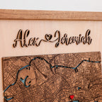 Close-up of custom raised wooden names above a detailed London map, showing the 3D lettering and handcrafted layered wood design.