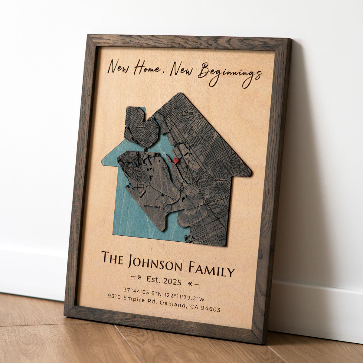 "New Home New Beginnings" personalized 3D wooden map in house shape with solid oak frame.