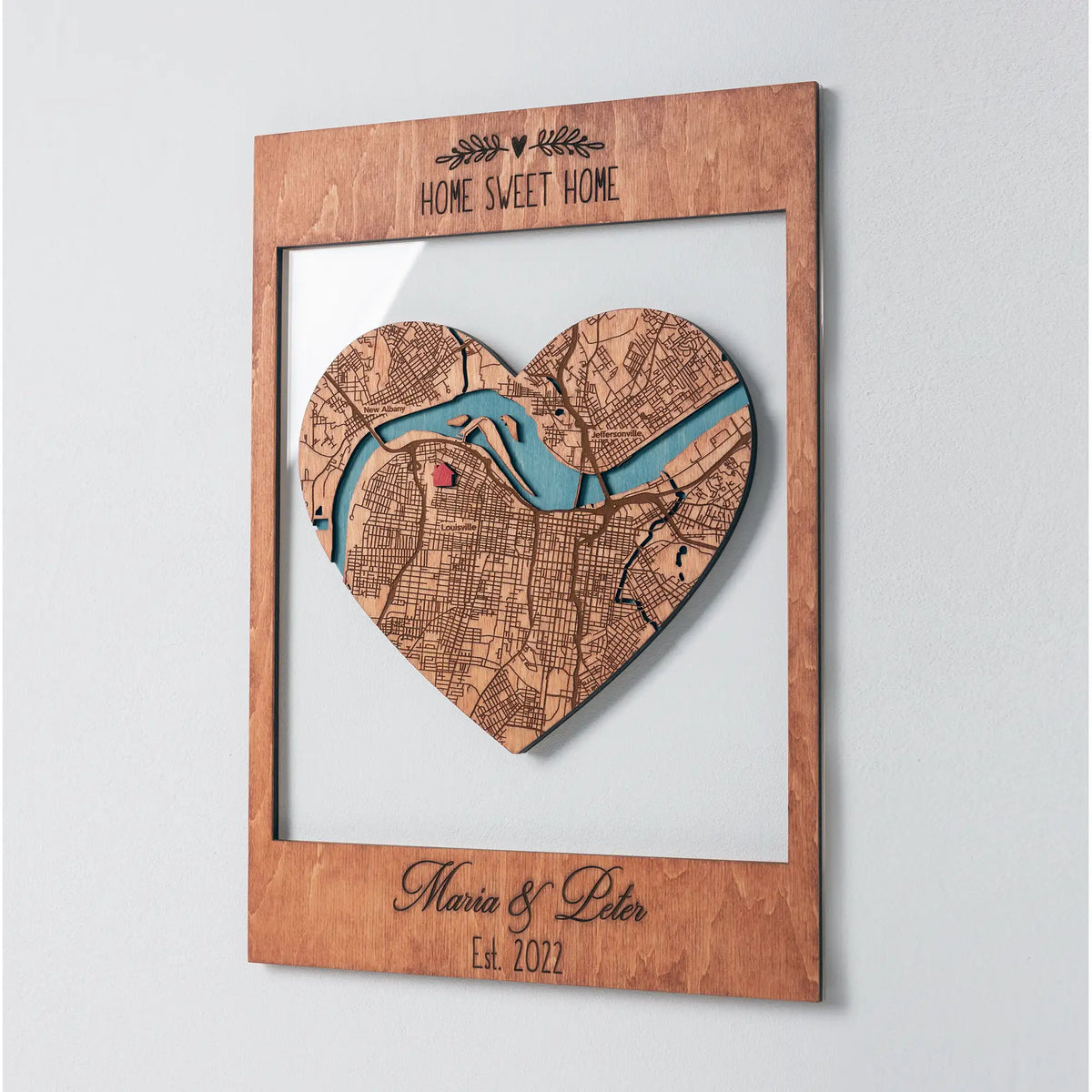 Angled view of Personalized New Home Map wooden keepsake with heart city map and custom Home Sweet Home frame