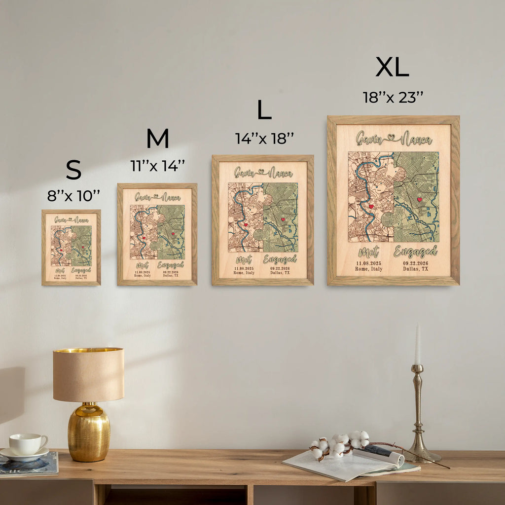 Four framed maps of different sizes on a wall above a wooden desk.