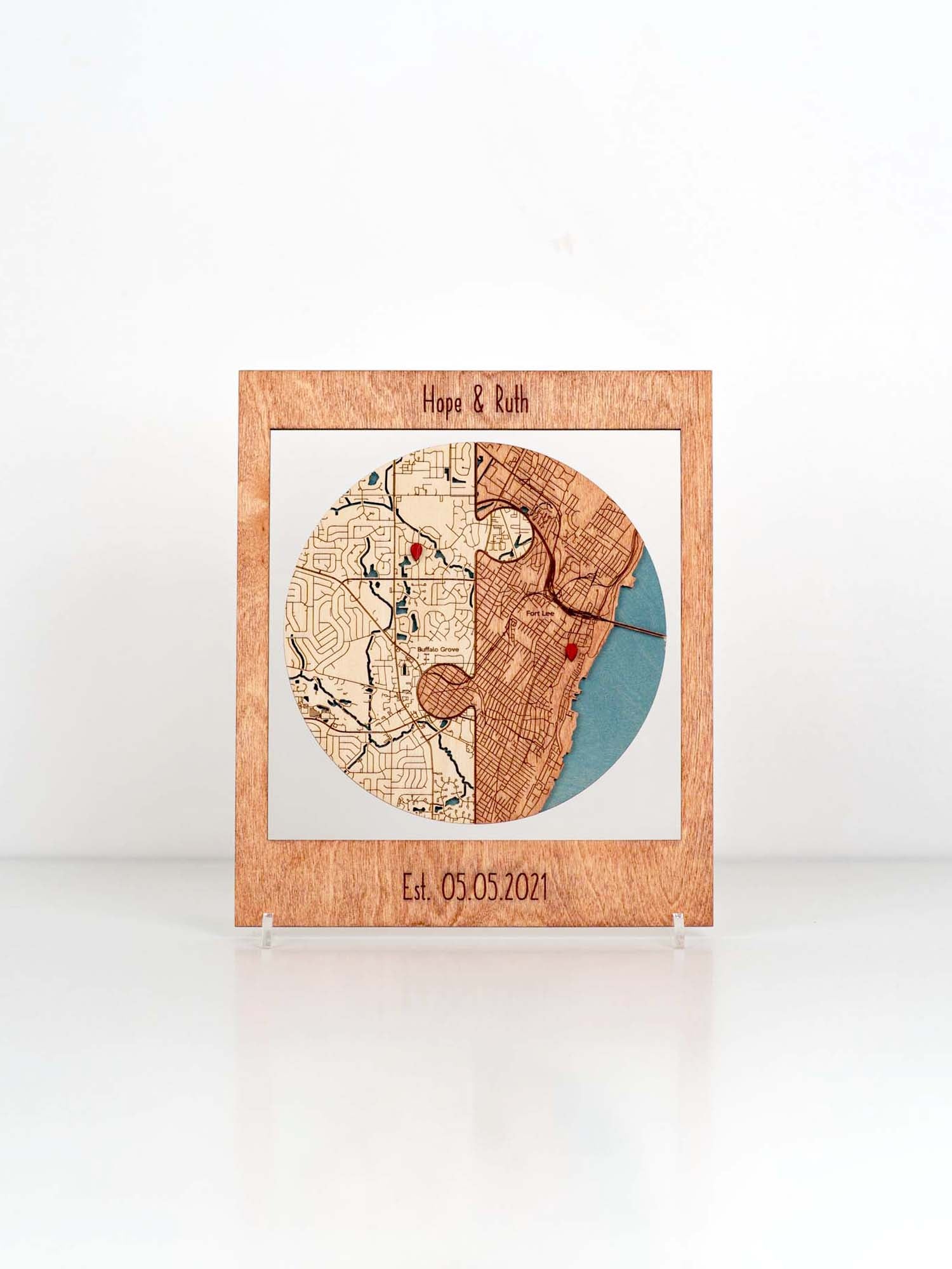 Custom-made wooden frame featuring a map puzzle with locations significant to a couple, representing places of personal importance. The piece is personalized with the names at the top and the custom date  which could signify an anniversary or special date in their relationship, such as a wedding.