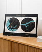 Framed location map displayed on a wooden surface, indicating engagement and wedding dates.