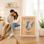 Personalized wedding anniversary gift for couples displayed in a bright living room, featuring a 3D wooden heart map, custom New York location, raised names, and white frame.