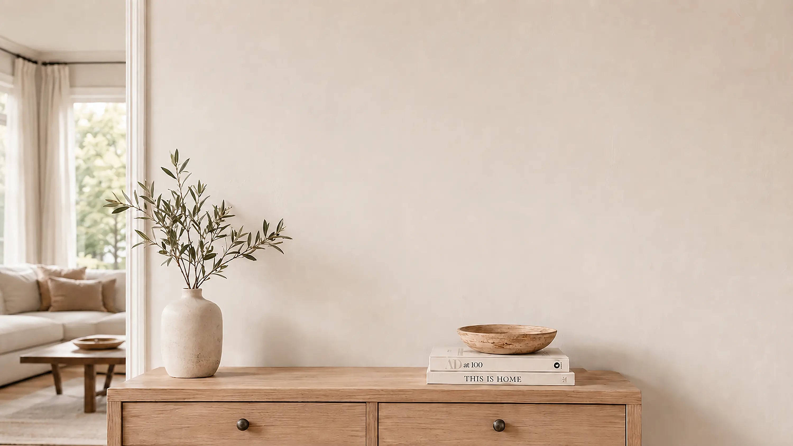 Minimalist living room wall before adding personalized wooden map wall art.