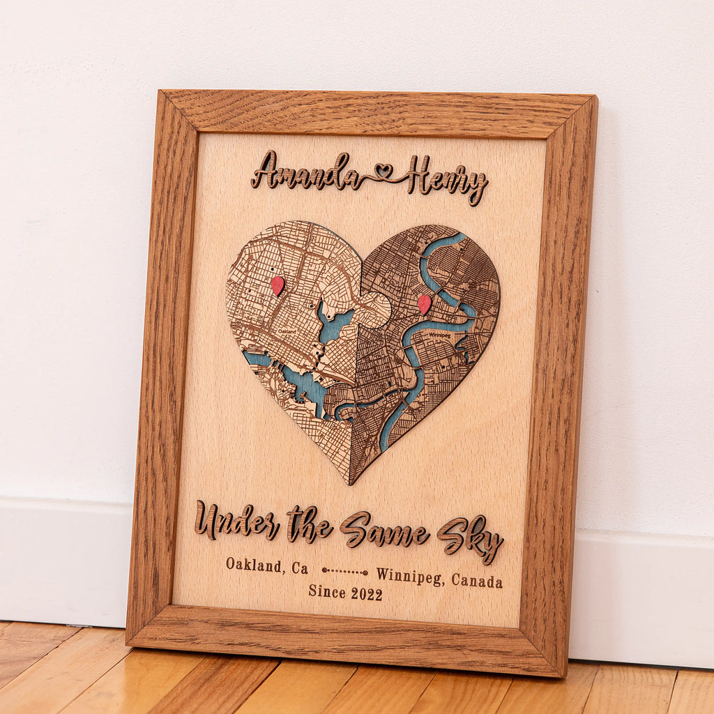 Custom anniversary map in Early American wood frame displayed on a shelf with raised 3D lettering and two locations.