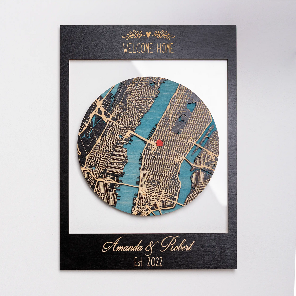 Custom housewarming gift with 3D wooden location art in black frame, personalized welcome home map wall decor with names and established date