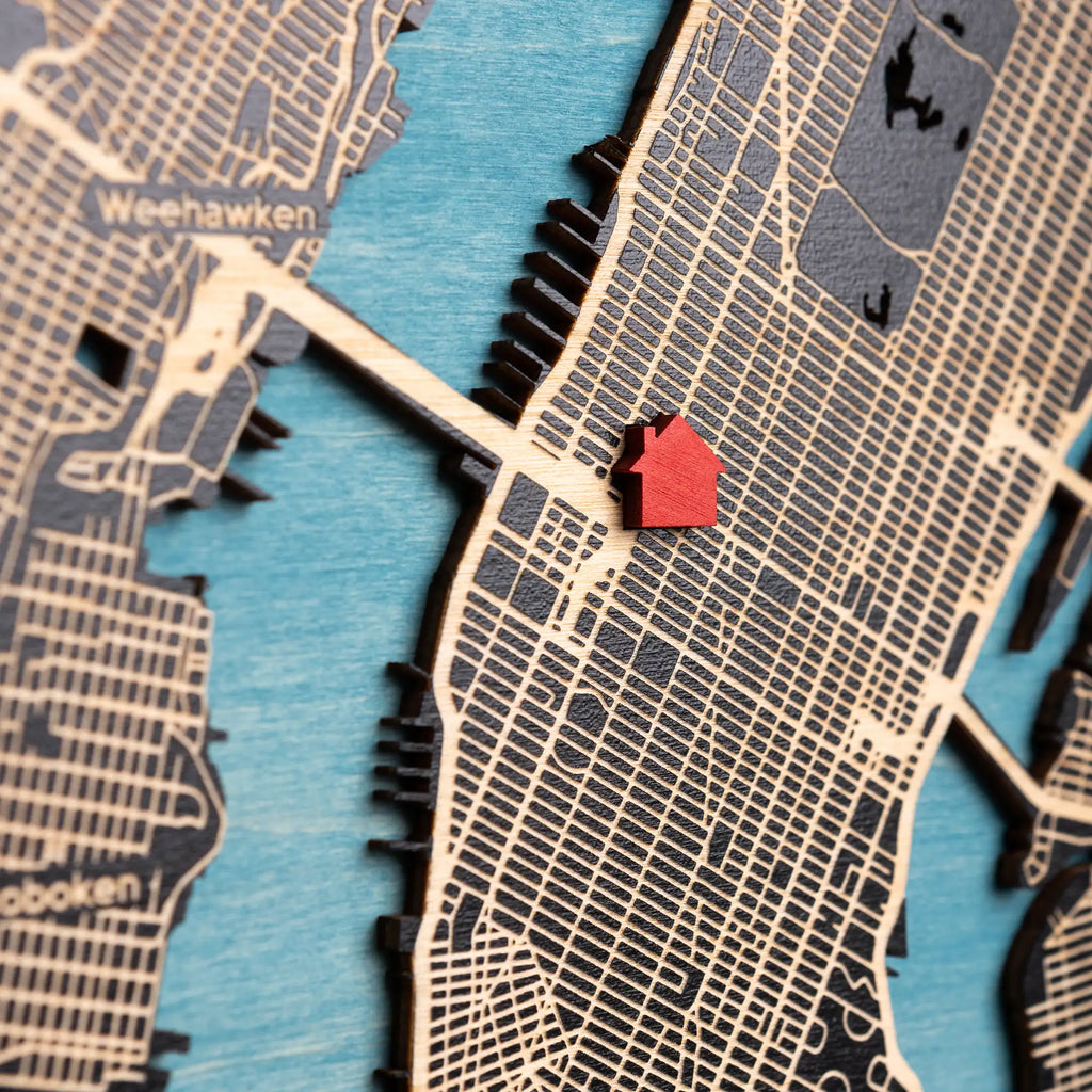 Close-up of 3D wooden location map with red house marker, custom housewarming gift showing personalized home address area