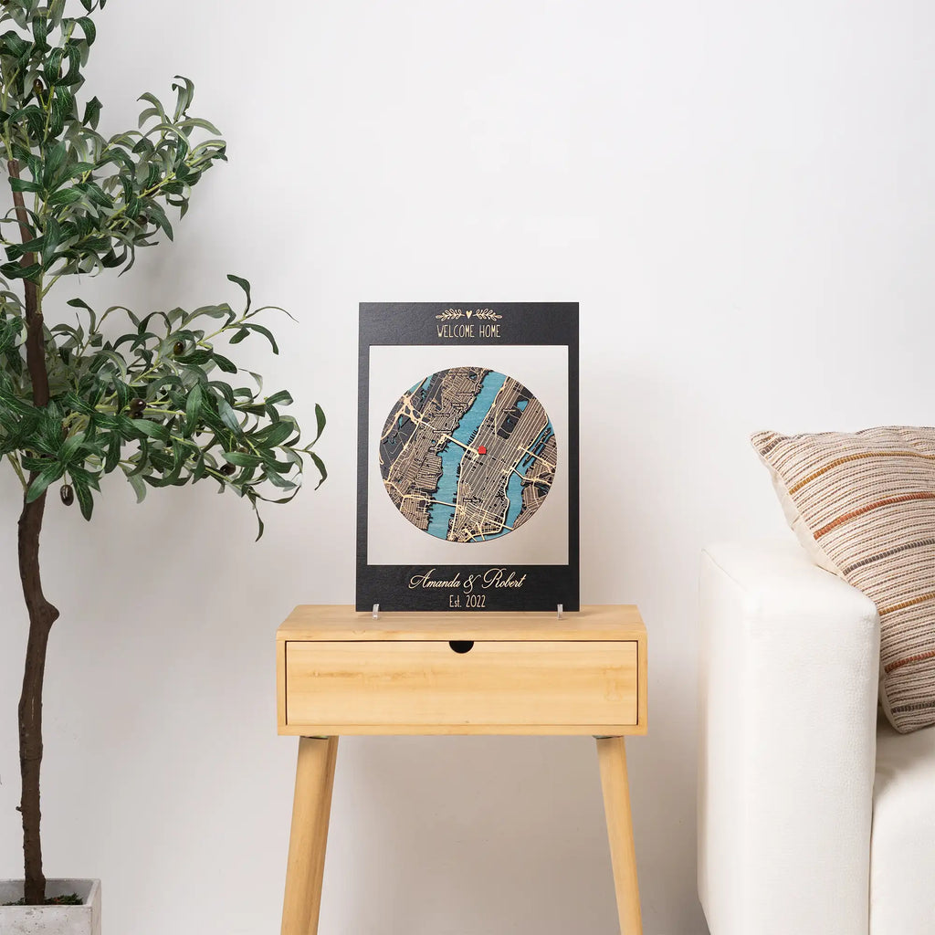 Personalized framed wooden location map displayed on side table, custom housewarming gift for new home with welcome home text