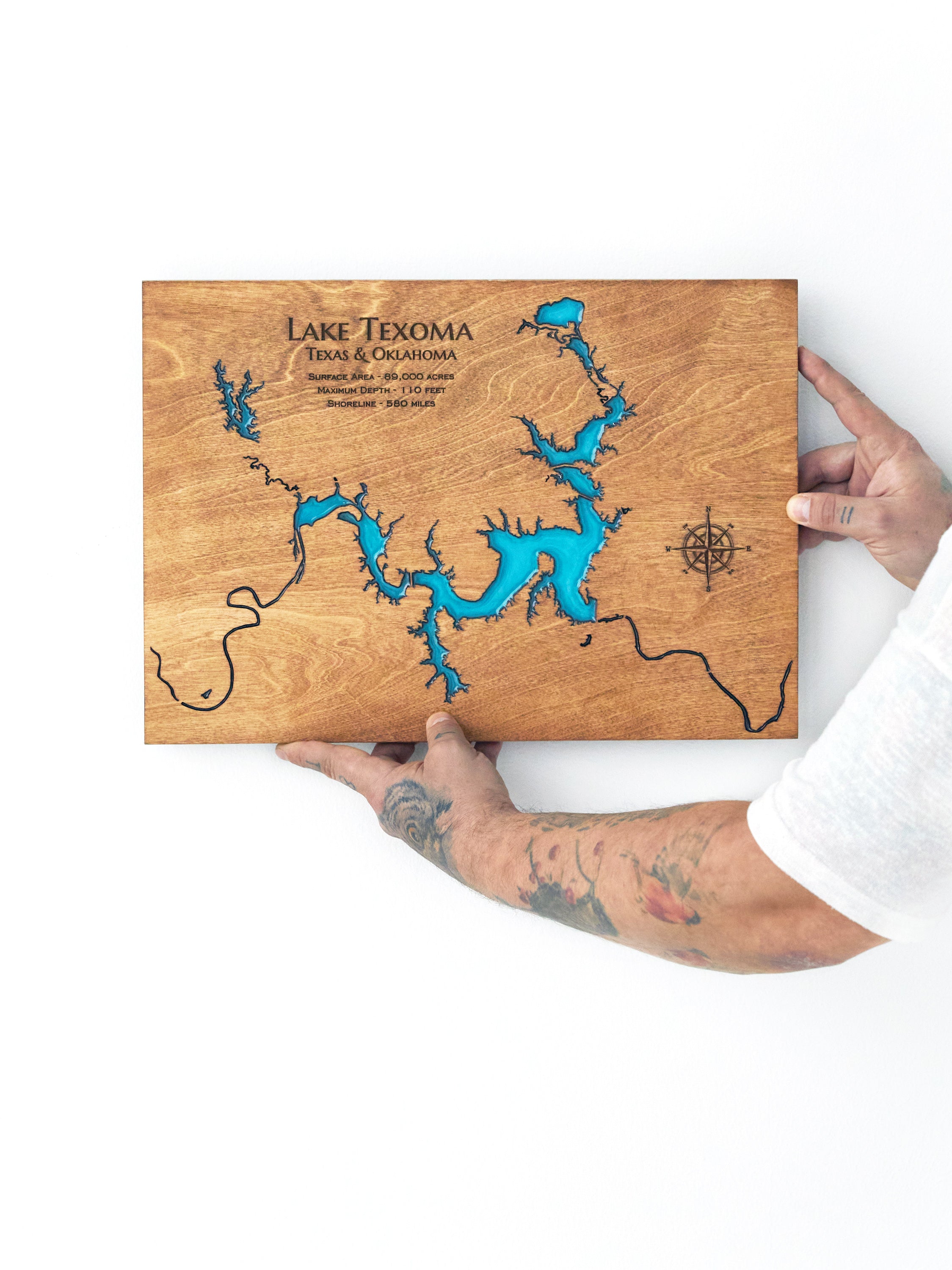 wooden epoxy resin map Lake Texoma on a white wall