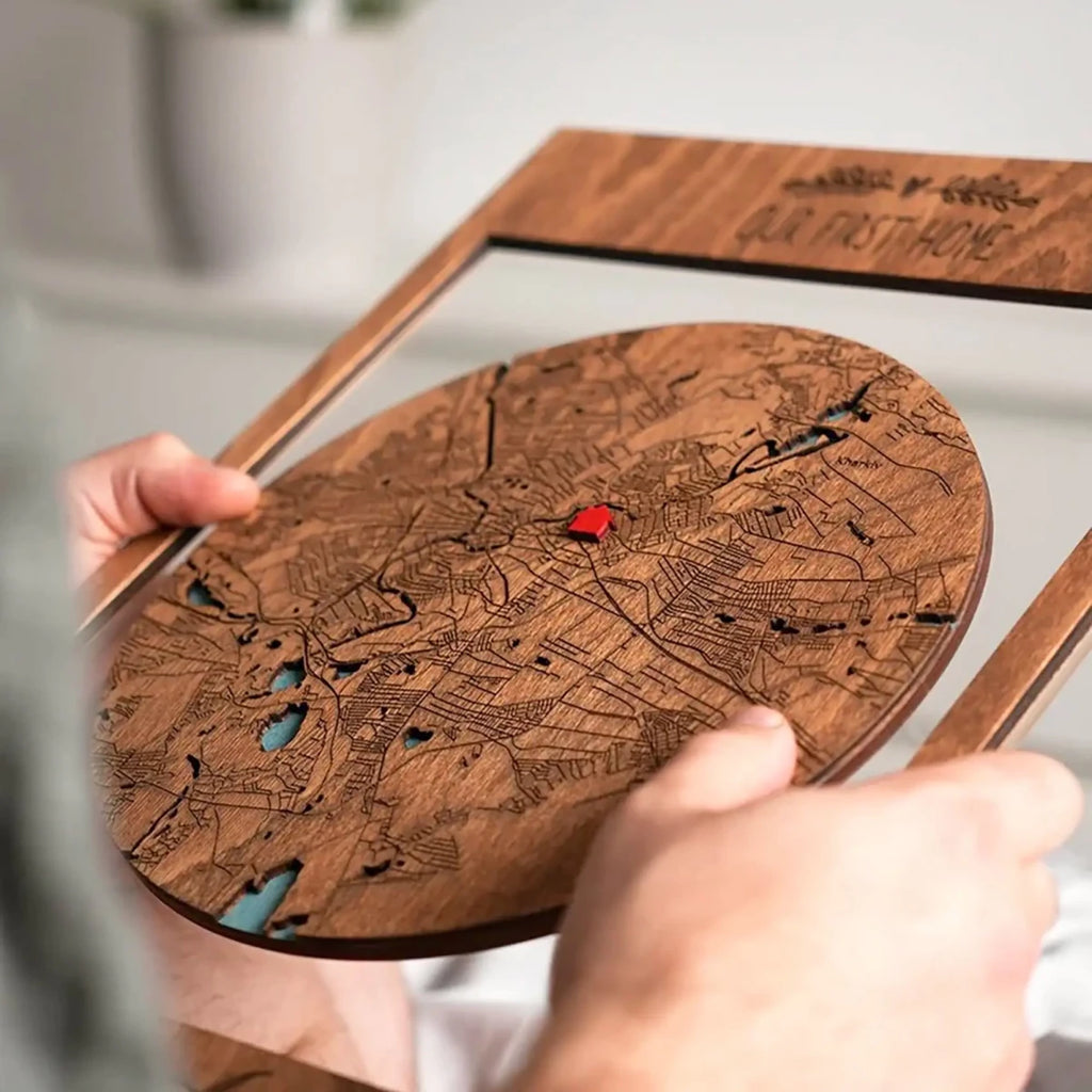 Personalized First Home map held in hands showing custom engraved city layout and home marker