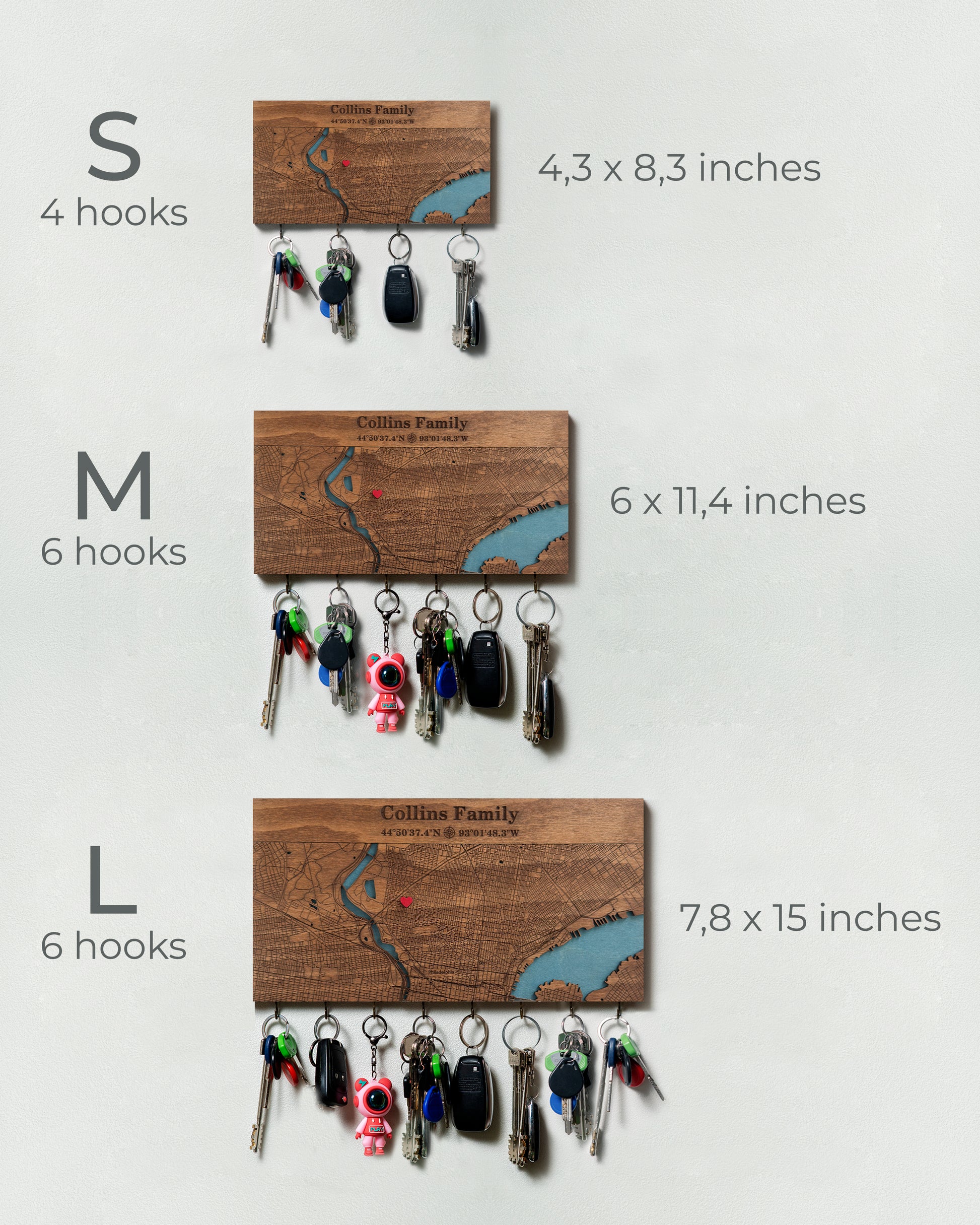 Wooden key holder with keychains displayed on a white background, showing size differences.
