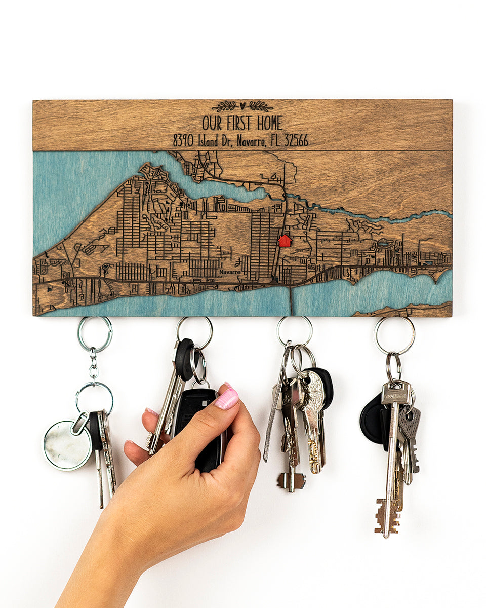 Key holder with map design and keys attached, against a white background