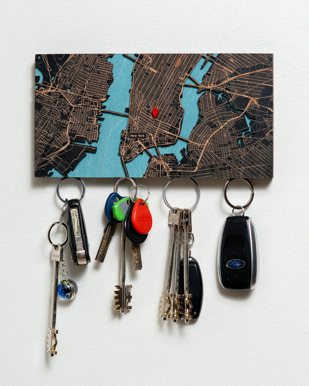 Key holder with keys attached to a map background