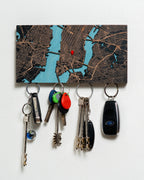 Key holder with keys attached to a map background