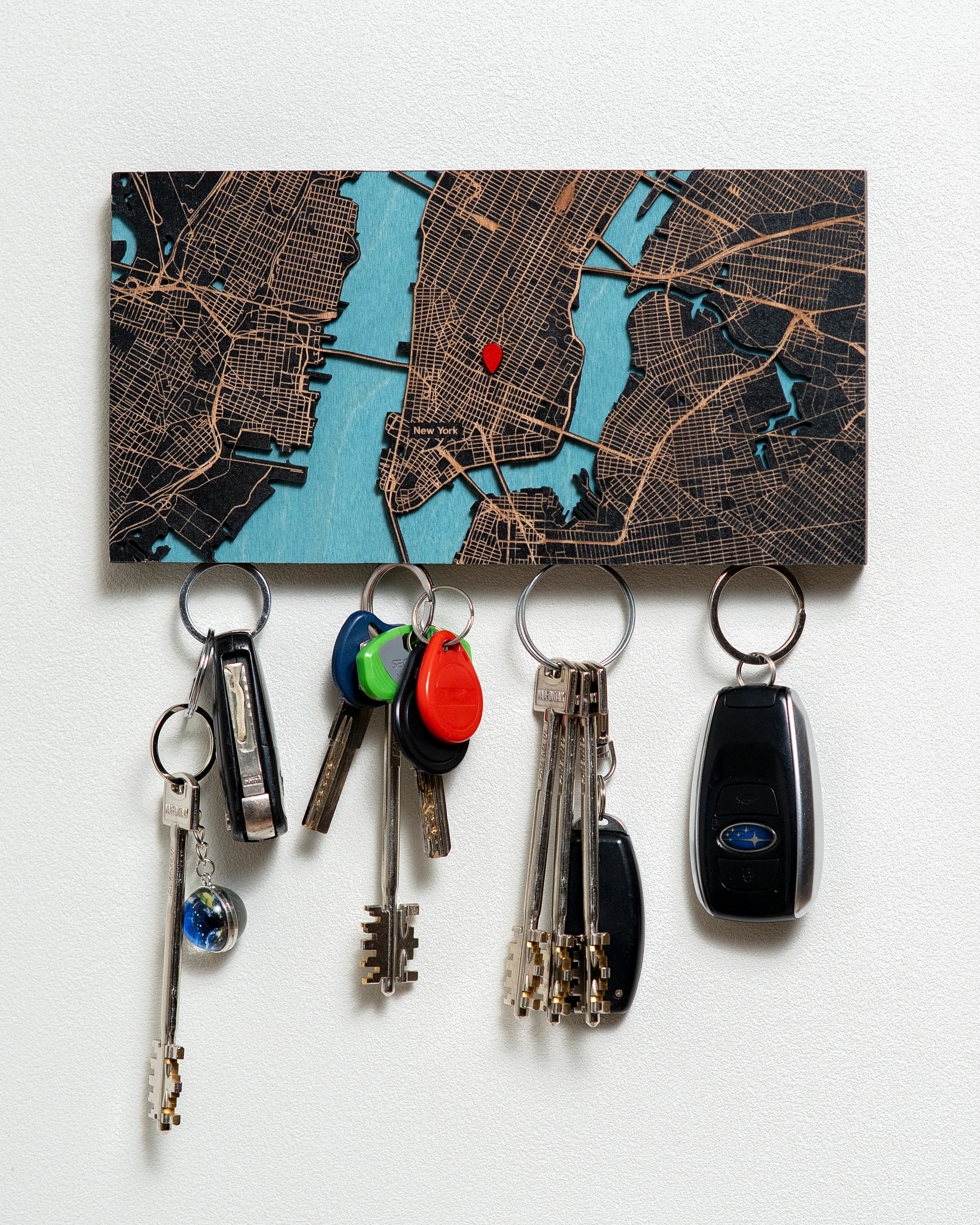 Key holder with keys attached to a map background