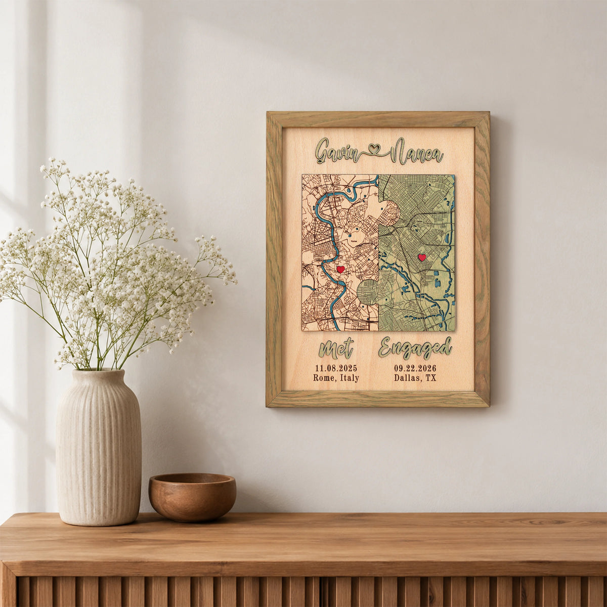 Met and Engaged custom map wall decor in sage frame with two locations, red pins, dates, and raised 3D lettering.