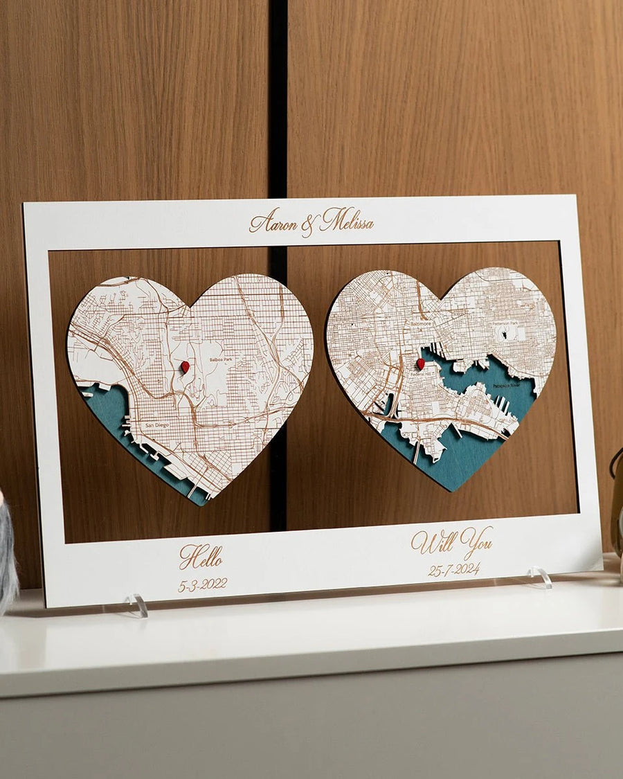 Two wooden heart maps in a horizontal frame for an anniversary