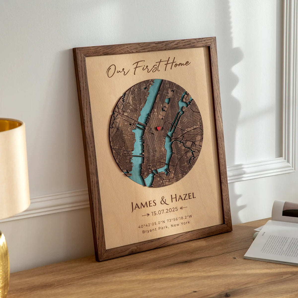 Personalized Our First Home Map in oak frame displayed on a table as custom address wall art for new homeowners