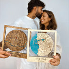 Couple holding personalized wooden location maps as romantic gift for anniversary or wedding