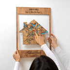 Detail of house-shaped wooden address map with red heart marker, personalized framed new home wall art for housewarming gift