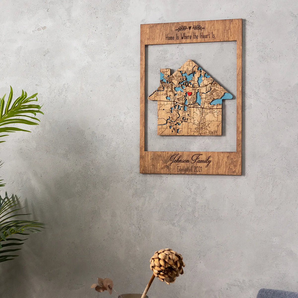 Framed address map housewarming gift displayed on wall in living room, personalized wooden new home keepsake with house-shaped map