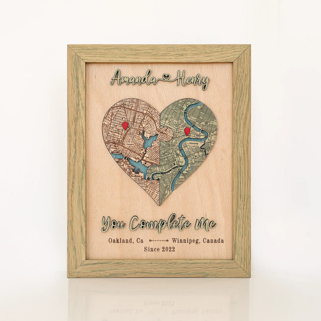 Personalized wooden love story map in sage frame with heart-shaped custom locations, raised 3D names, and romantic phrase.