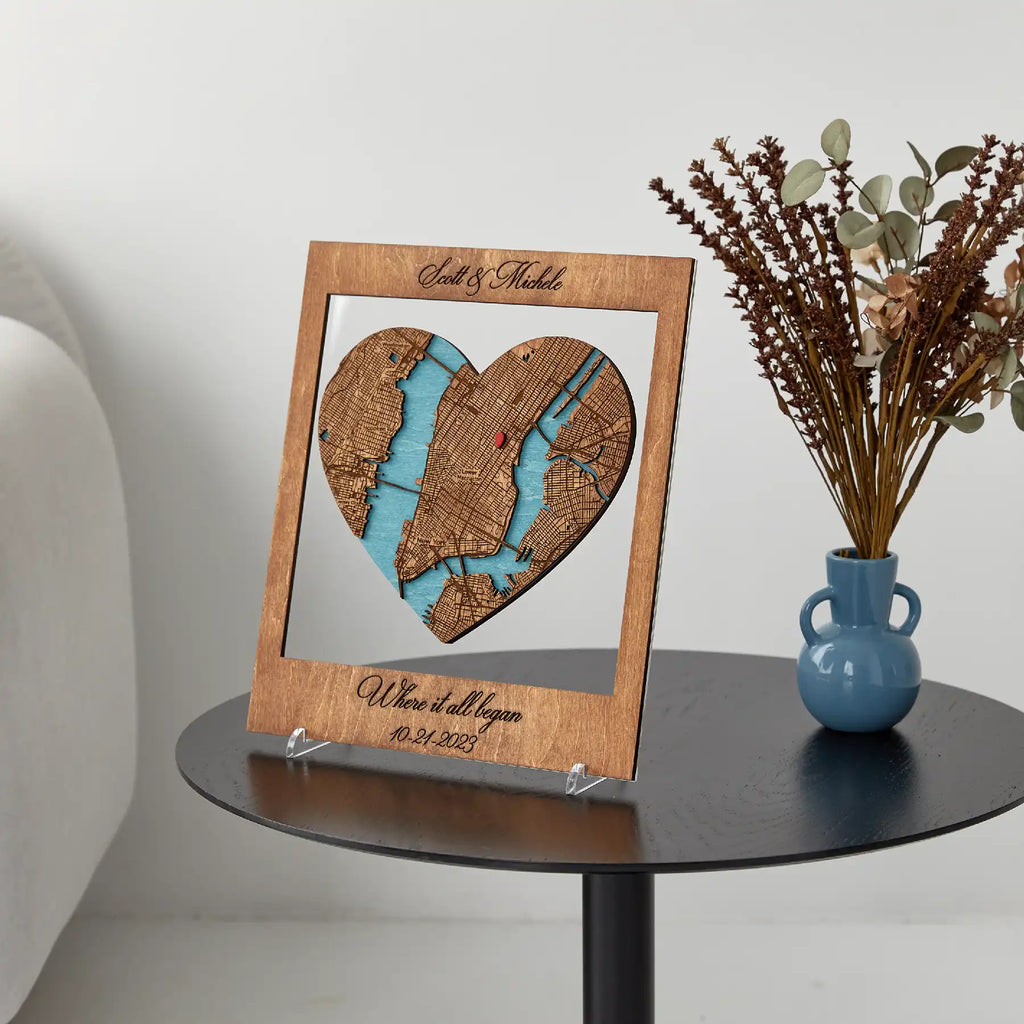 Personalized wooden Where It All Began map displayed on black table as anniversary gift decor