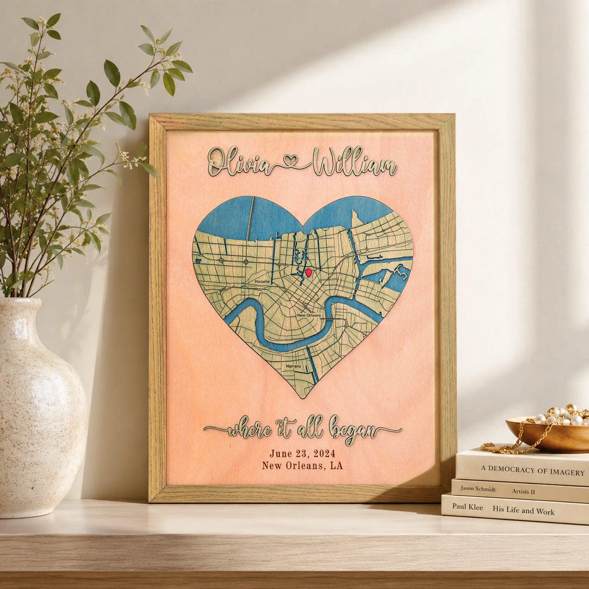Romantic anniversary map for her with heart-shaped 3D wooden New Orleans location map, raised laser-cut names, custom date, Where It All Began wording, and sage oak frame.