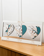 Heart-shaped map artwork with personalized text on a wooden surface