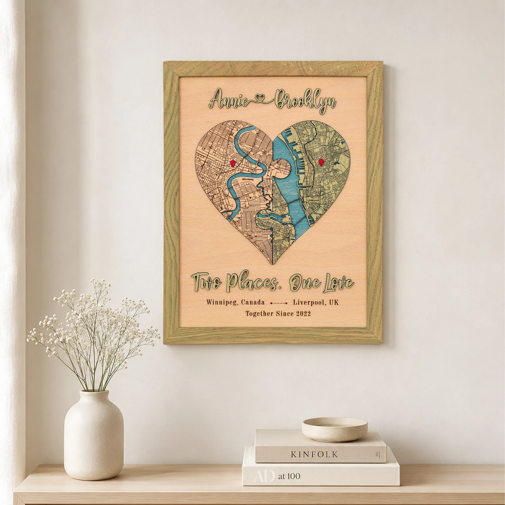 Two Places One Love wooden map in sage frame displayed on a wall with custom locations and raised 3D lettering.