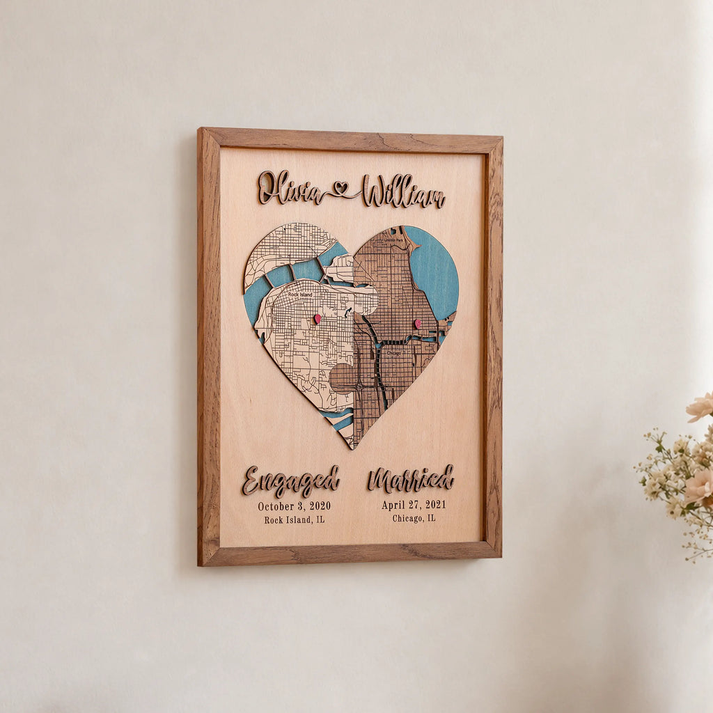 Wedding anniversary heart map displayed on a wall with personalized names, engagement date, wedding date, and custom locations.