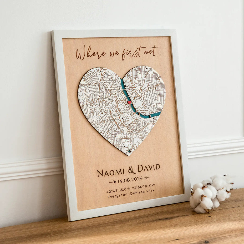 Where We Met plaque map in white frame displayed on table in angled lifestyle view