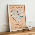 Where We Met plaque map in white frame displayed on table in angled lifestyle view