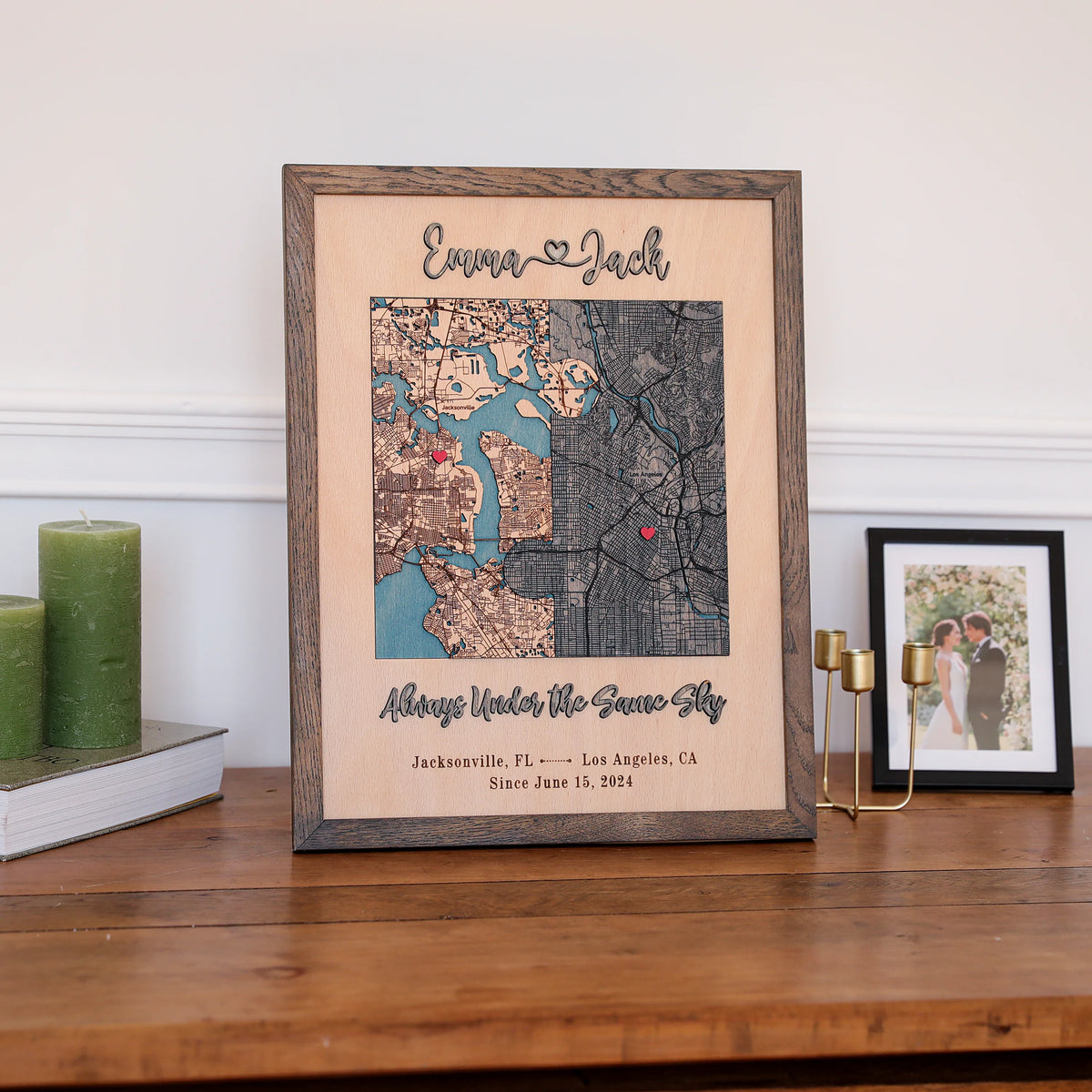 Wooden anniversary gift for him styled on a shelf with custom map, couple names, date, and oak frame.