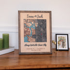 Wooden anniversary gift for him styled on a shelf with custom map, couple names, date, and oak frame.